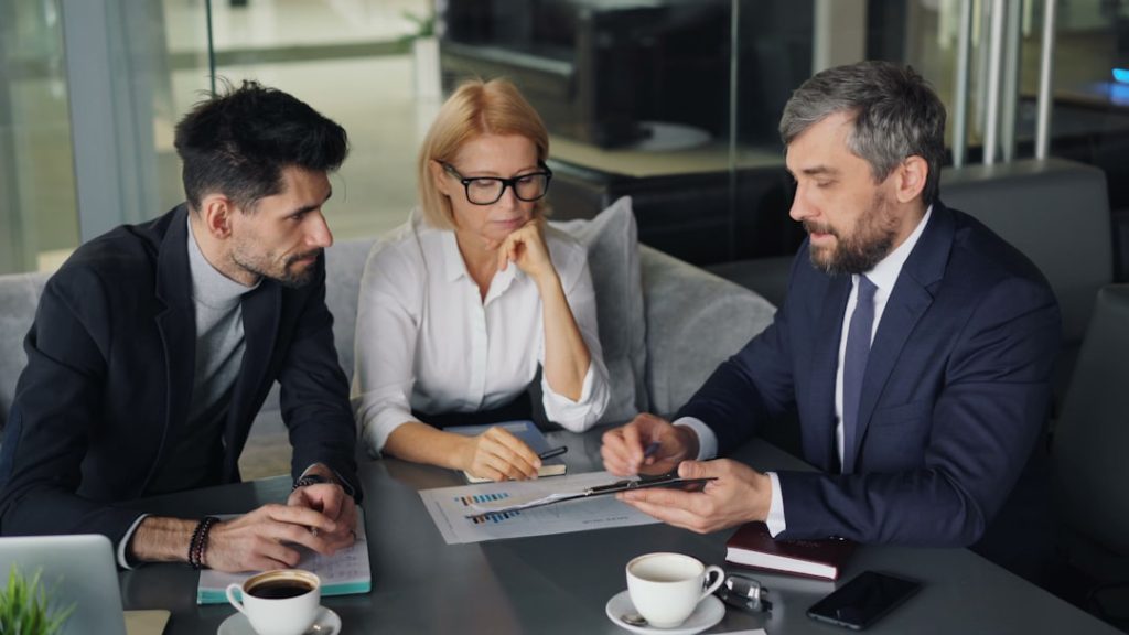 Business professionals meeting around a table